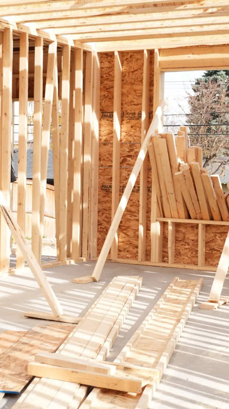 Stacked framing lumber inside a Calgary new build